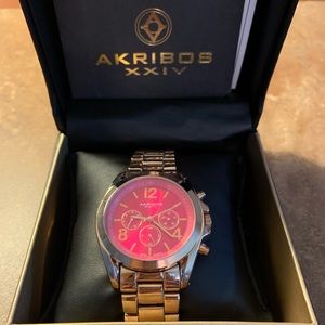 Akribos XXIV lg pink face with rose gold brac.